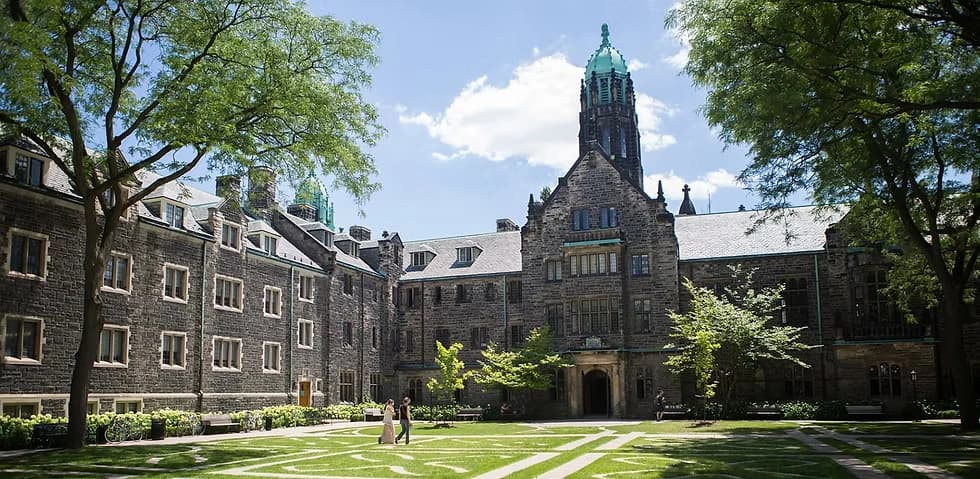 University building with spire and green dome